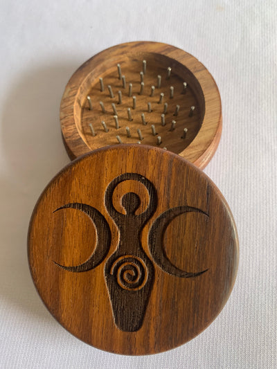 Wooden herb and incense resin grinder with metal pins and natural wood finish